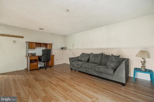2057 Grove St, Allentown, PA 18104 - living room featuring an office area, light wood-style flooring, and a textured ceiling