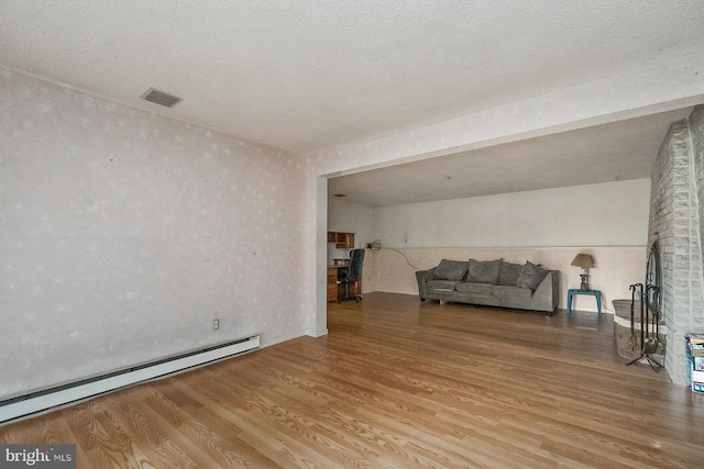 2057 Grove St, Allentown, PA 18104 - living area featuring a baseboard radiator and wood finished floors