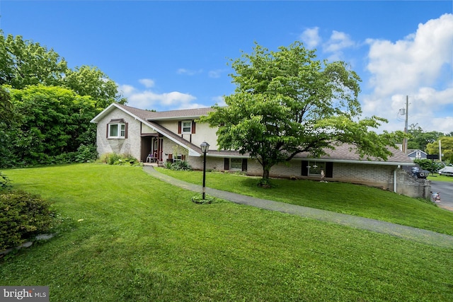 2057 Grove St, Allentown, PA 18104 - traditional-style house featuring brick siding, a front yard, and stucco siding