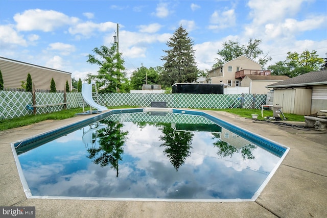 2057 Grove St, Allentown, PA 18104 - view of swimming pool with a water slide, a fenced backyard, and a patio