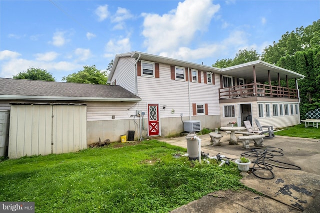 2057 Grove St, Allentown, PA 18104 - rear view of house with a patio, a lawn, and a balcony