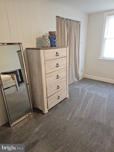 43 Briarcliffe Rd, Glenolden, PA 19036 - unfurnished bedroom with dark colored carpet and baseboards