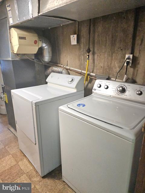 43 Briarcliffe Rd, Glenolden, PA 19036 - laundry area with separate washer and dryer and wood walls