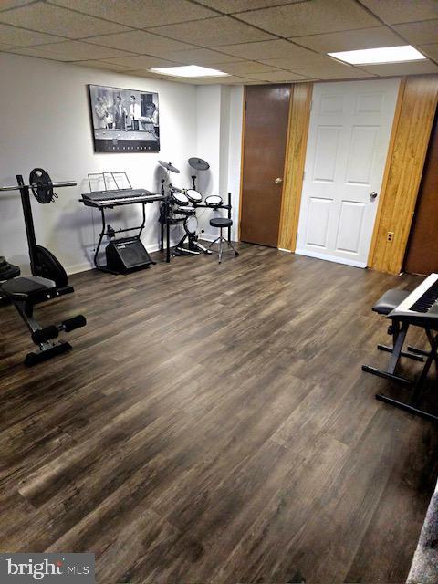 43 Briarcliffe Rd, Glenolden, PA 19036 - exercise room featuring dark wood-style floors and a paneled ceiling