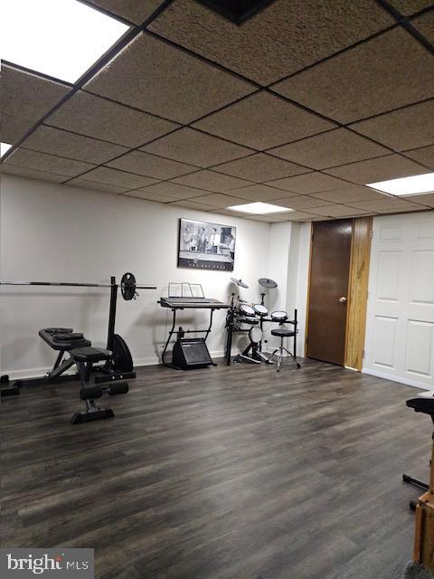 43 Briarcliffe Rd, Glenolden, PA 19036 - workout room with dark wood finished floors and baseboards