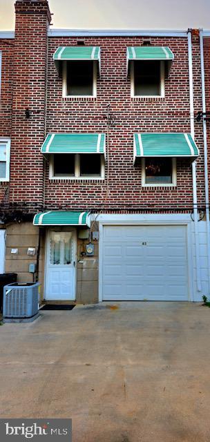 43 Briarcliffe Rd, Glenolden, PA 19036 - view of property with an attached garage and driveway