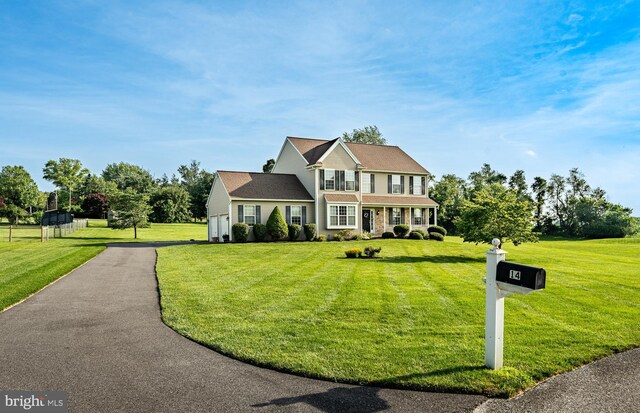 14 Burk Rd, Cochranville, PA 19330 - view of front facade featuring a front lawn