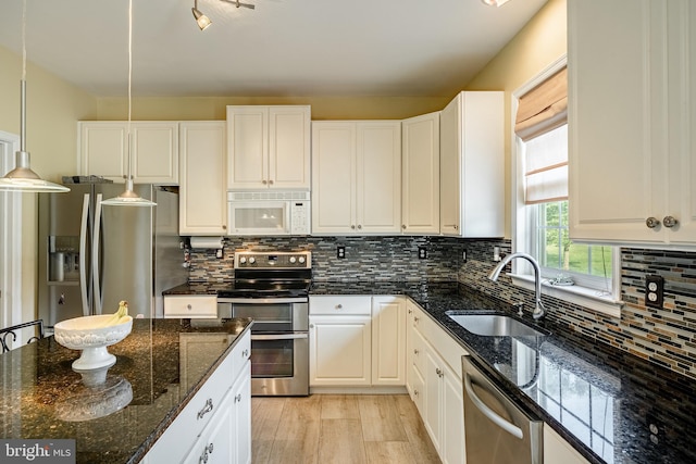 14 Burk Rd, Cochranville, PA 19330 - kitchen featuring stainless steel appliances, white cabinets, dark stone counters, and backsplash