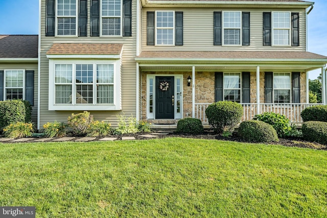 14 Burk Rd, Cochranville, PA 19330 - view of front of house featuring a front yard, stone siding, and a porch