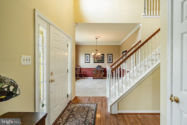 14 Burk Rd, Cochranville, PA 19330 - entrance foyer with stairway, a chandelier, wood finished floors, and crown molding