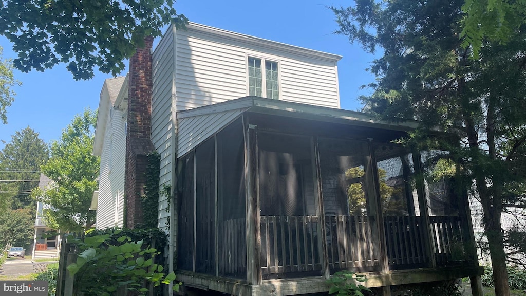 116 Peyton Ave, Haddonfield, NJ 08033 - view of side of property featuring a sunroom and a chimney