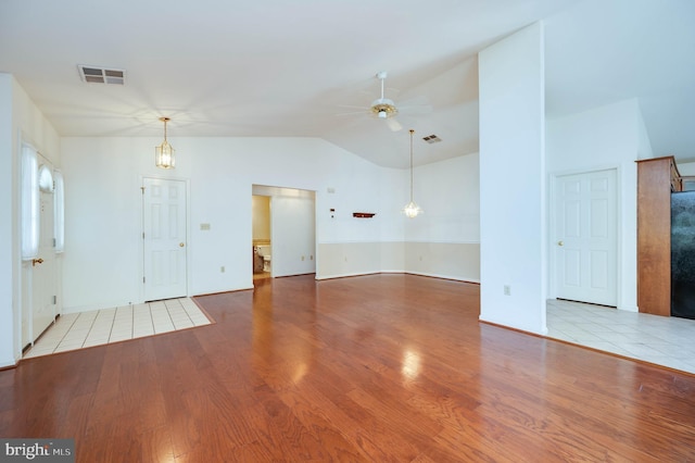 3217 Garfield Ave, Reading, PA 19605 - empty room featuring ceiling fan, wood finished floors, and vaulted ceiling