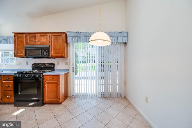 3217 Garfield Ave, Reading, PA 19605 - kitchen featuring black appliances, lofted ceiling, brown cabinets, decorative backsplash, and light countertops