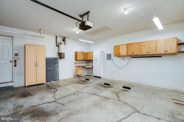 3217 Garfield Ave, Reading, PA 19605 - garage with a garage door opener and a central vacuum unit
