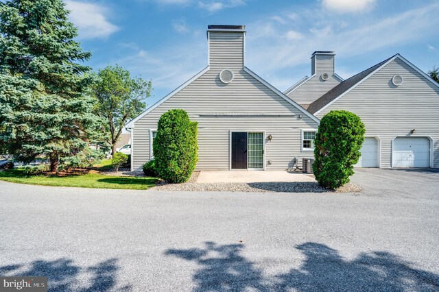3217 Garfield Ave, Reading, PA 19605 - rear view of house featuring a chimney