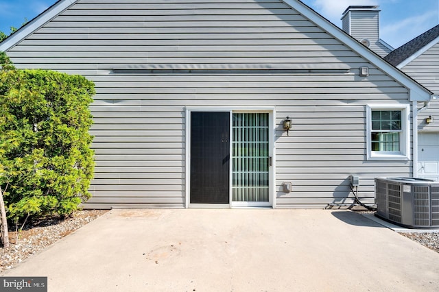 3217 Garfield Ave, Reading, PA 19605 - back of house with a patio area and a chimney