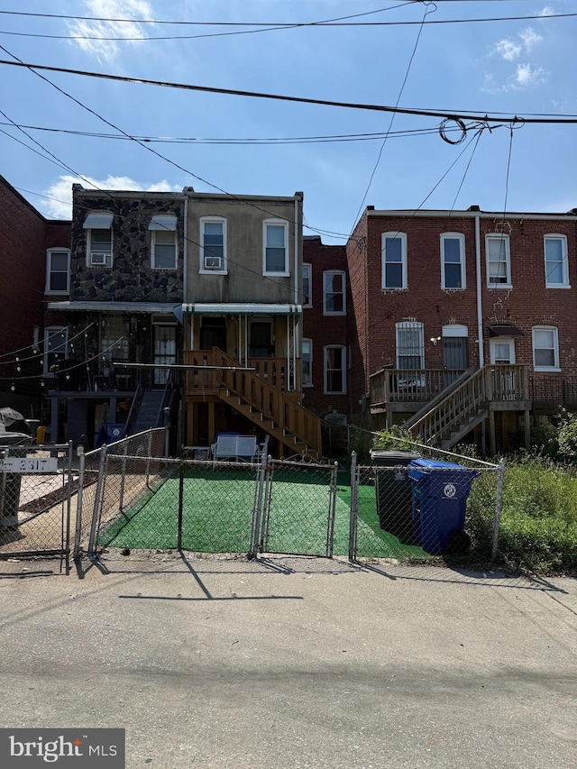 2319 N Rosedale St, Baltimore, MD 21216 - multi unit property featuring a gate, a fenced front yard, and stairway