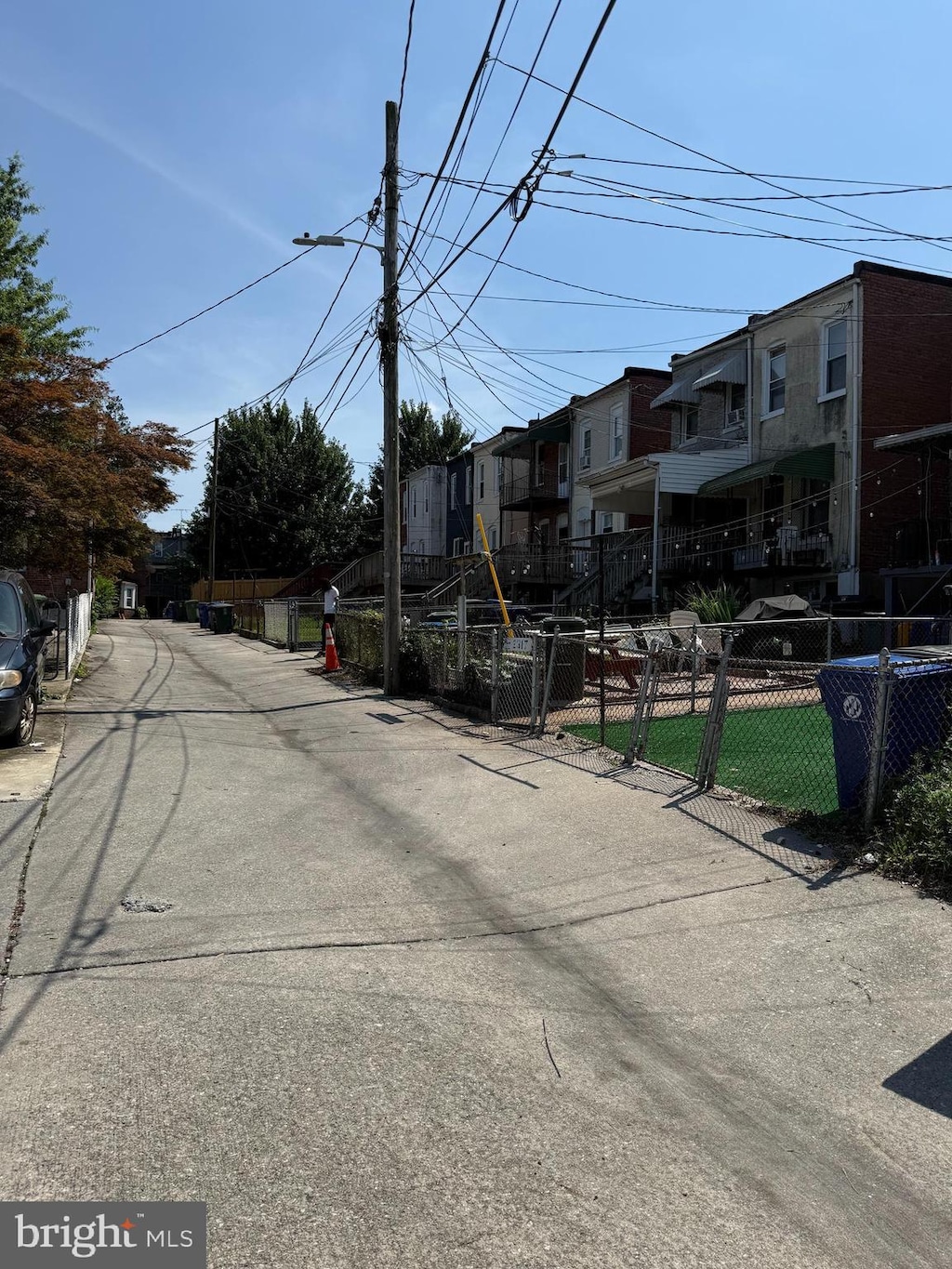 2319 N Rosedale St, Baltimore, MD 21216 - view of asphalt road featuring a residential view and street lights