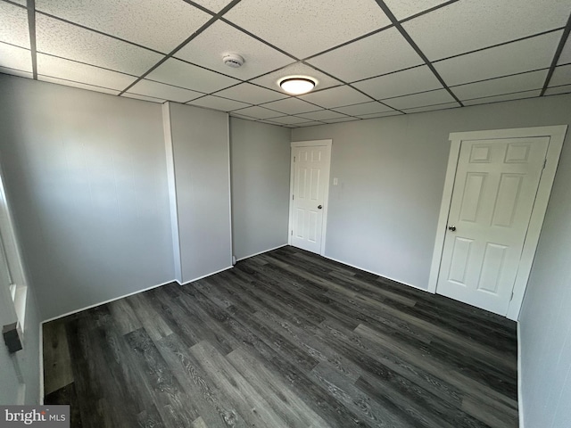 217 Washington St, Trenton, NJ 08611 - empty room with a smoke detector, dark wood-type flooring, and a drop ceiling