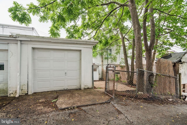 3827 Marshall Rd, Drexel Hill, PA 19026 - garage featuring a gate and driveway