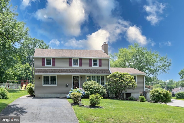 56 Meadowbrook Ave, Hatboro, PA 19040 - traditional-style home featuring a chimney, a front lawn, driveway, and roof with shingles