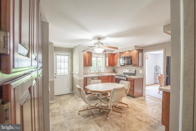 56 Meadowbrook Ave, Hatboro, PA 19040 - kitchen with stainless steel appliances, light countertops, a ceiling fan, and brown cabinets