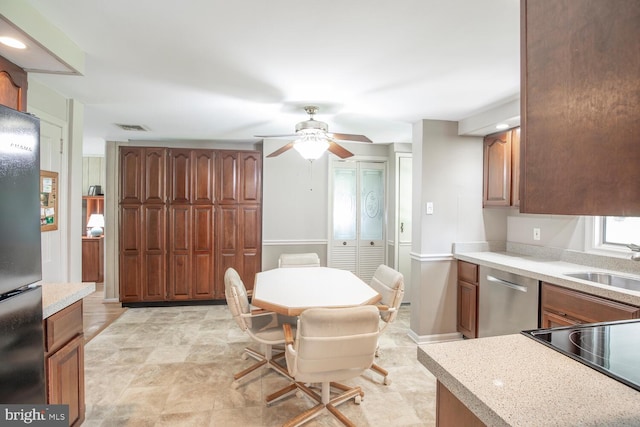 56 Meadowbrook Ave, Hatboro, PA 19040 - kitchen with stainless steel appliances, ceiling fan, light countertops, and brown cabinetry