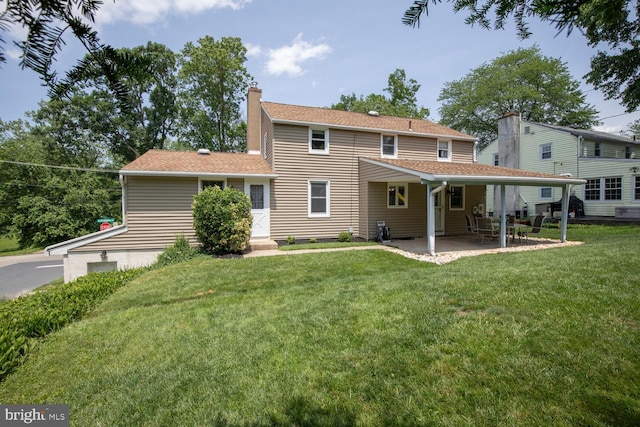 56 Meadowbrook Ave, Hatboro, PA 19040 - rear view of property featuring a chimney, a lawn, a patio, and roof with shingles