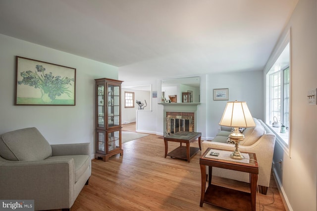 56 Meadowbrook Ave, Hatboro, PA 19040 - living room with light wood-style floors and a brick fireplace