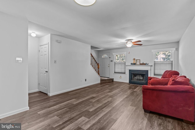 31 Violet Ln, Newtown, PA 18940 - living room featuring stairway, wood finished floors, ceiling fan, and a fireplace