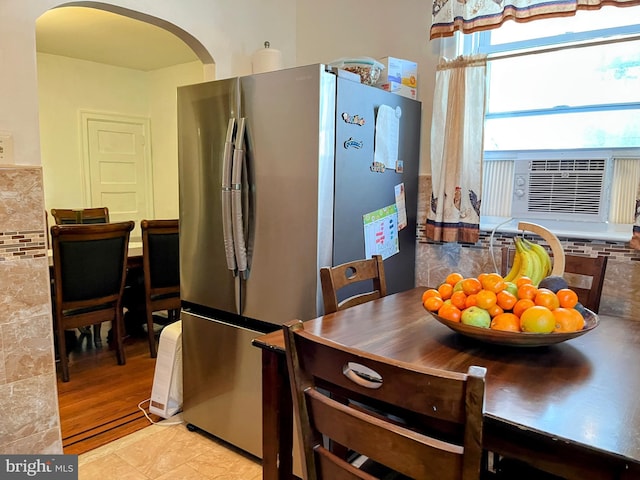 5905 N 3rd St, Philadelphia, PA 19120 - kitchen featuring freestanding refrigerator, arched walkways, and cooling unit