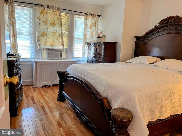 5905 N 3rd St, Philadelphia, PA 19120 - bedroom featuring radiator, hardwood / wood-style floors, and cooling unit