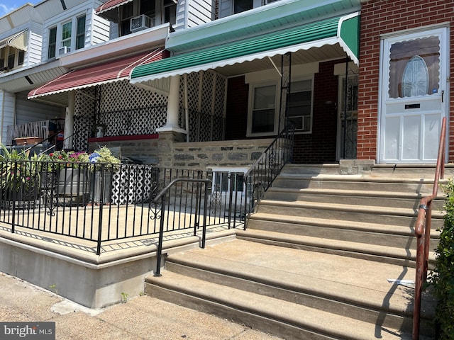 5905 N 3rd St, Philadelphia, PA 19120 - doorway to property with brick siding and cooling unit