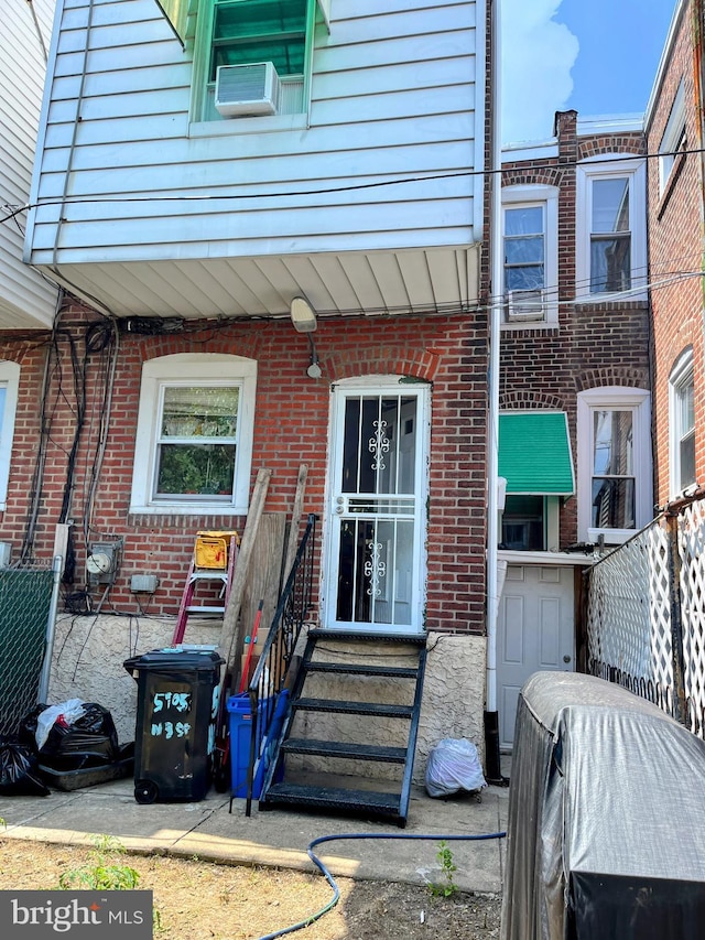 5905 N 3rd St, Philadelphia, PA 19120 - view of exterior entry featuring brick siding and cooling unit