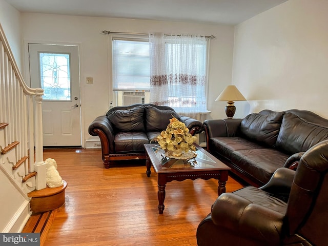 5905 N 3rd St, Philadelphia, PA 19120 - living room featuring stairway, light wood-style floors, and cooling unit