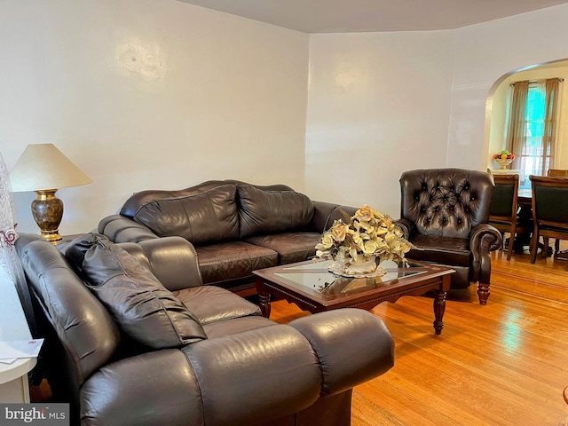 5905 N 3rd St, Philadelphia, PA 19120 - living area with arched walkways and light wood-type flooring