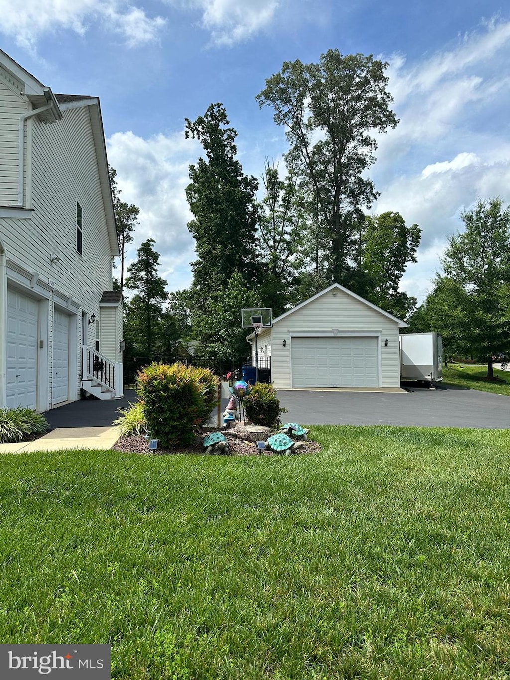 26201 Serenity View Ct, Mechanicsville, MD 20659 - view of home's exterior with a lawn, an outbuilding, and a garage