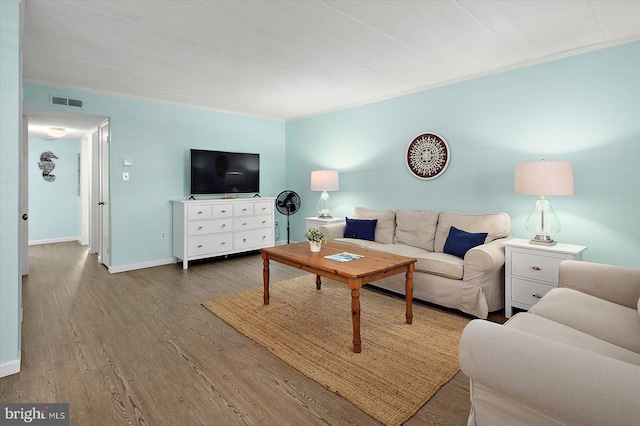 9 76th St Unit 203, Ocean City, MD 21842 - living room featuring wood finished floors and baseboards