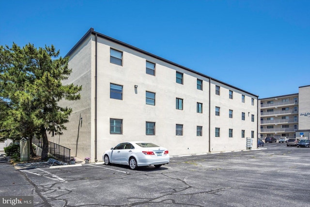 9 76th St Unit 203, Ocean City, MD 21842 - view of building exterior with uncovered parking