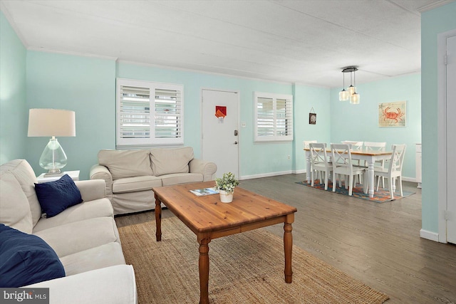 9 76th St Unit 203, Ocean City, MD 21842 - living area featuring wood finished floors and a chandelier