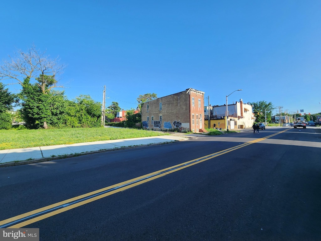 1837 N Chester St, Baltimore, MD 21213 - view of asphalt road featuring sidewalks, street lighting, and curbs