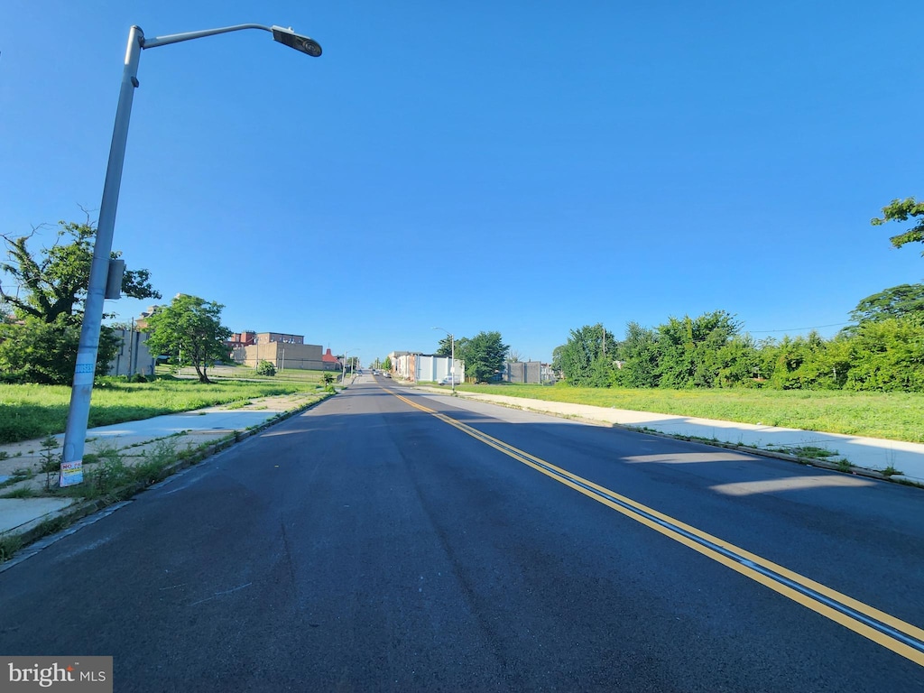 1837 N Chester St, Baltimore, MD 21213 - view of asphalt street with street lighting, sidewalks, and curbs