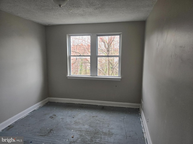 2660 Park Heights Ter, Baltimore, MD 21215 - empty room featuring a textured ceiling and baseboards