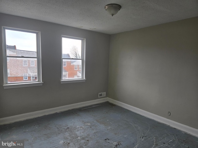 2660 Park Heights Ter, Baltimore, MD 21215 - spare room featuring a textured ceiling and baseboards