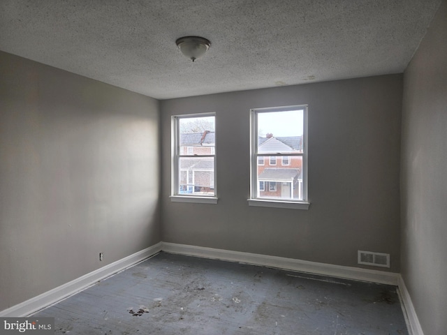 2660 Park Heights Ter, Baltimore, MD 21215 - spare room featuring baseboards and a textured ceiling
