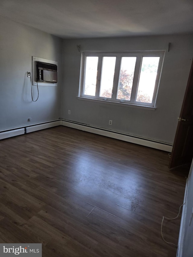 8305 Ridgeway St, Philadelphia, PA 19111 - unfurnished room with an AC wall unit, dark wood-style floors, and a baseboard radiator