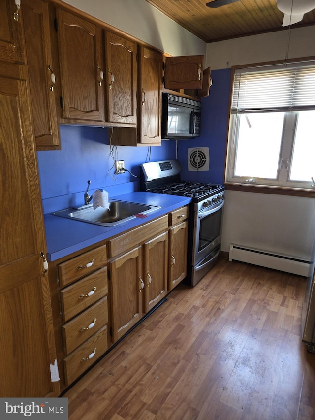 8305 Ridgeway St, Philadelphia, PA 19111 - kitchen with black microwave, a baseboard heating unit, stainless steel range with gas cooktop, dark wood-style flooring, and wood ceiling
