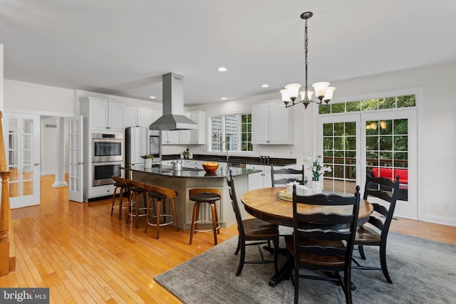 7 Shady Brook Ln, Cranbury, NJ 08512 - dining room featuring light wood-style flooring, a chandelier, recessed lighting, and french doors