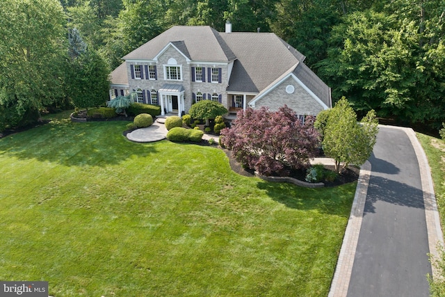 7 Shady Brook Ln, Cranbury, NJ 08512 - colonial house with stone siding and a front lawn