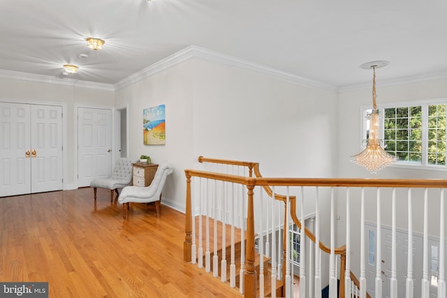 7 Shady Brook Ln, Cranbury, NJ 08512 - corridor with wood finished floors, a chandelier, crown molding, and an upstairs landing